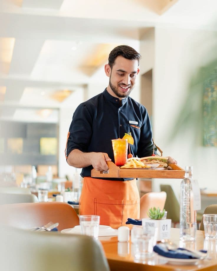 Waiter serving food